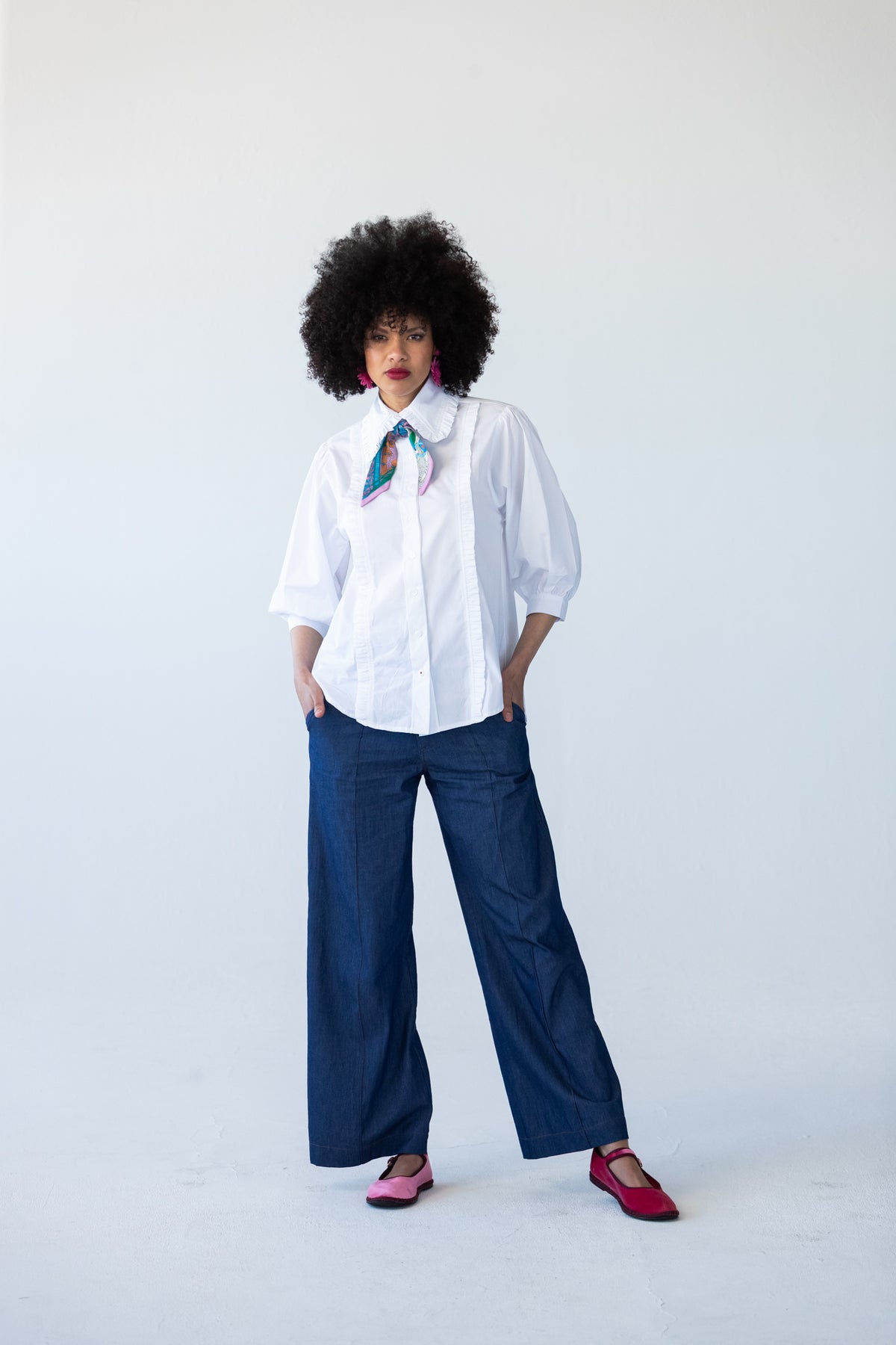 Claire frill shirt, full-length front view styled with Blair wide-leg denim pants and neck scarf