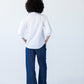 Claire frill shirt, back view styled with Blair wide-leg denim pants