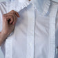 Claire frill shirt, close-up of collar and frill trim with hand at shoulder