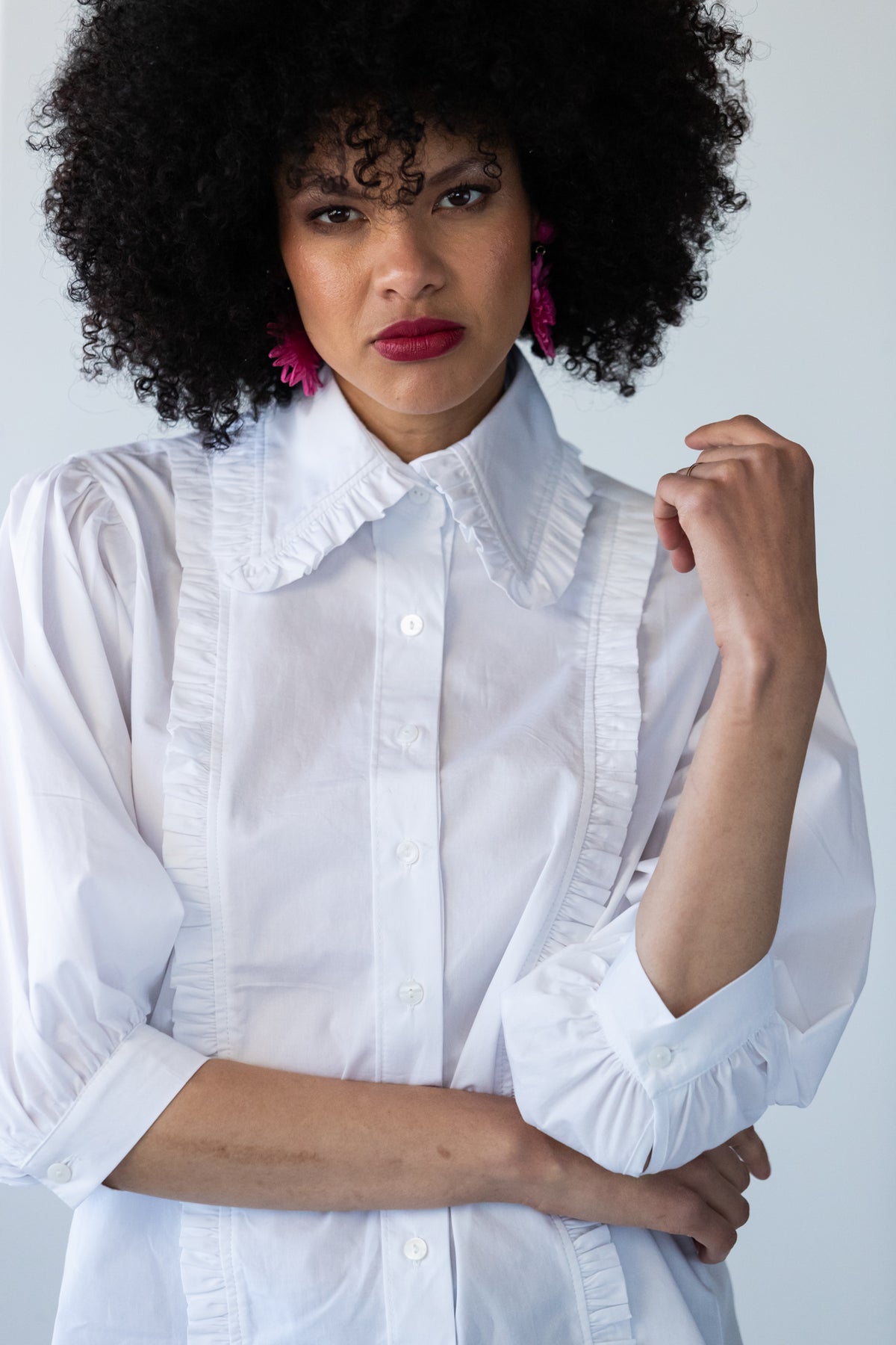 Claire frill shirt, front close-up with arms crossed showing cuffs and frill trim
