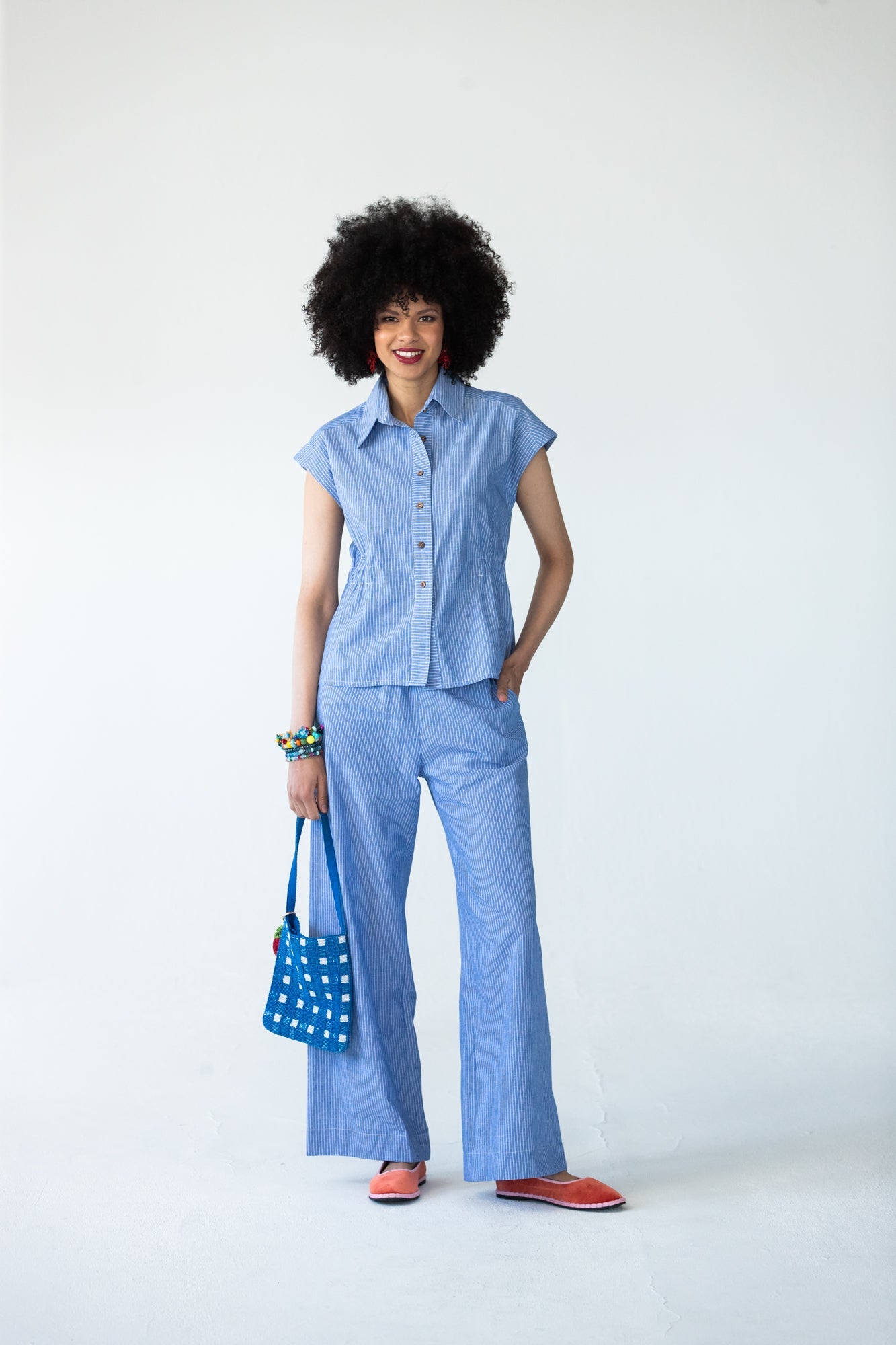 Sydney wide leg stripe pants, front view with hand on hip