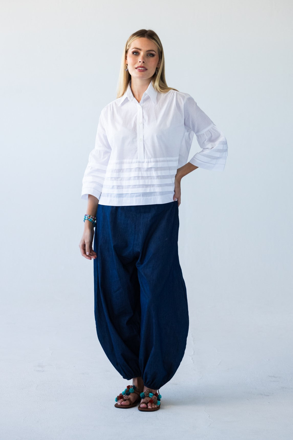 Serafina white pintuck shirt, back view full length styled with Stella Balloon Pants