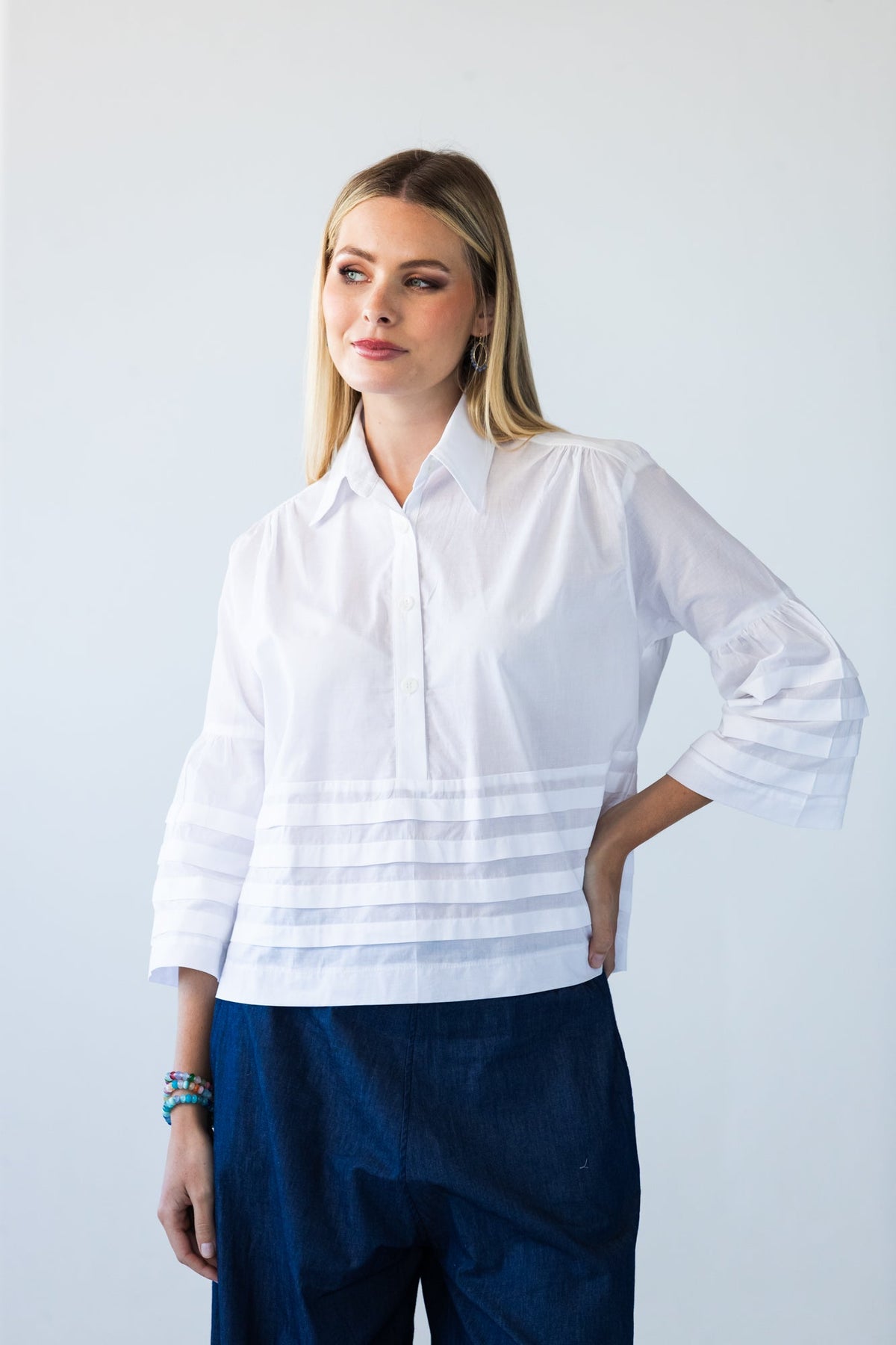 Serafina white cotton voile pintuck shirt, front view close up looking to the side