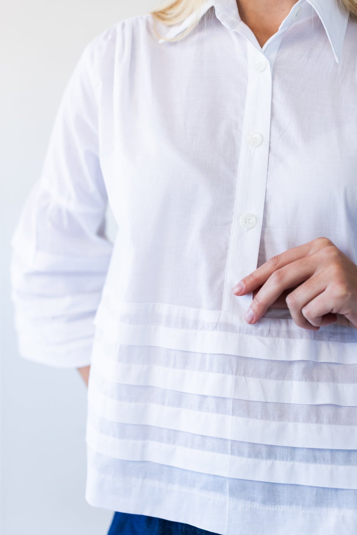 Serafina white pintuck shirt, close up of collar, placket and hem pintuck band