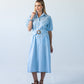 Harlow blue and white stripe shirt dress, front view with self-tie belt and puff sleeves showing collar