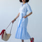Frankie blue check shirt dress, front view walking with tote bag