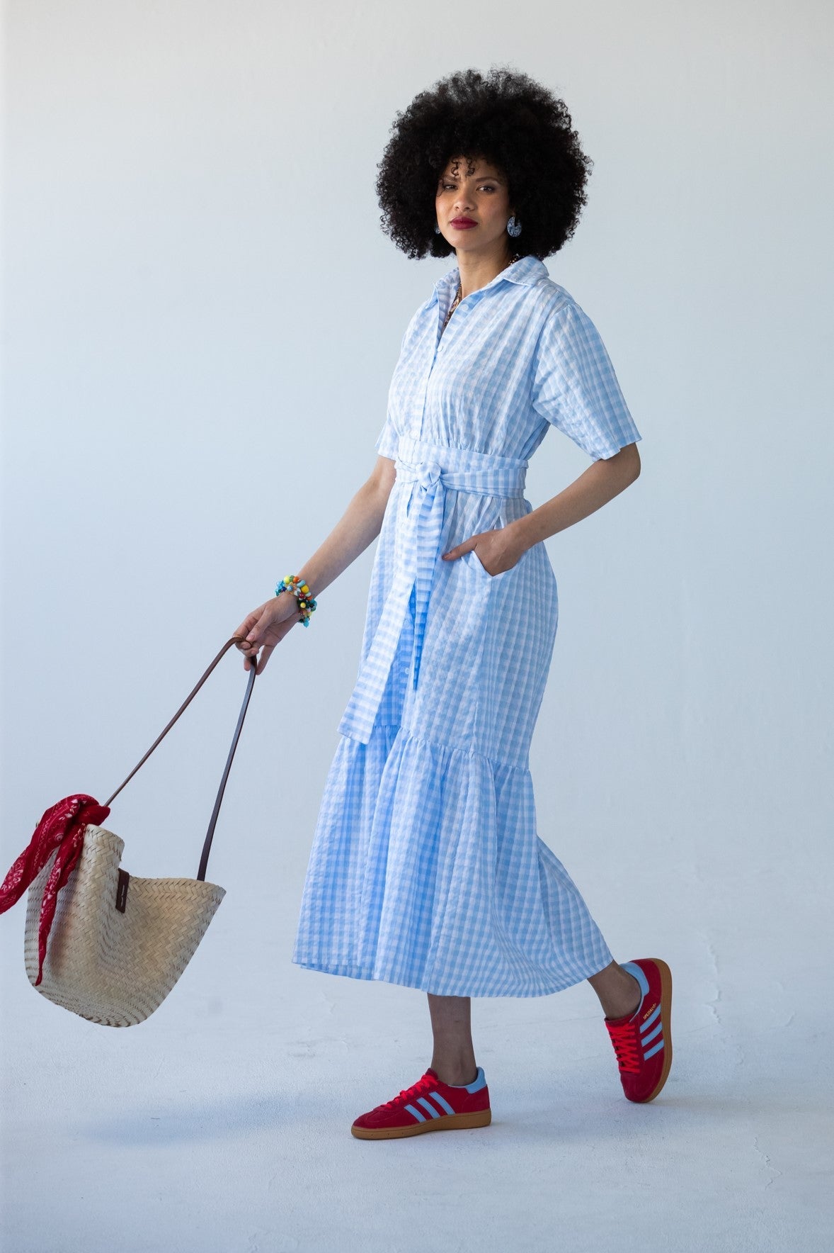 Frankie blue check shirt dress, front view walking with tote bag
