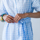 Frankie blue check dress, close-up of tied belt and hands at waist