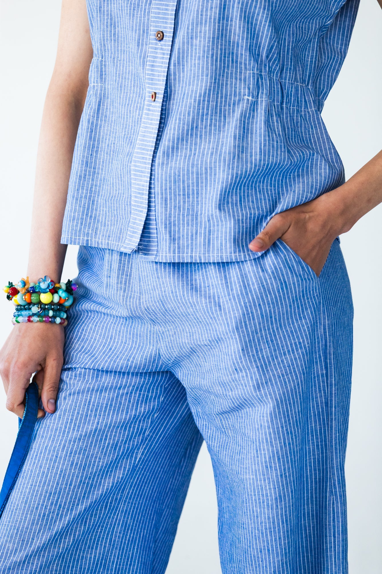 Reese stripe shirt, close up of waist and hand in pocket