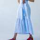 Frankie blue check dress, side view walking showing tiered hem