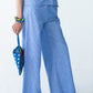 Sydney wide leg stripe pants, close up front view with beaded bag