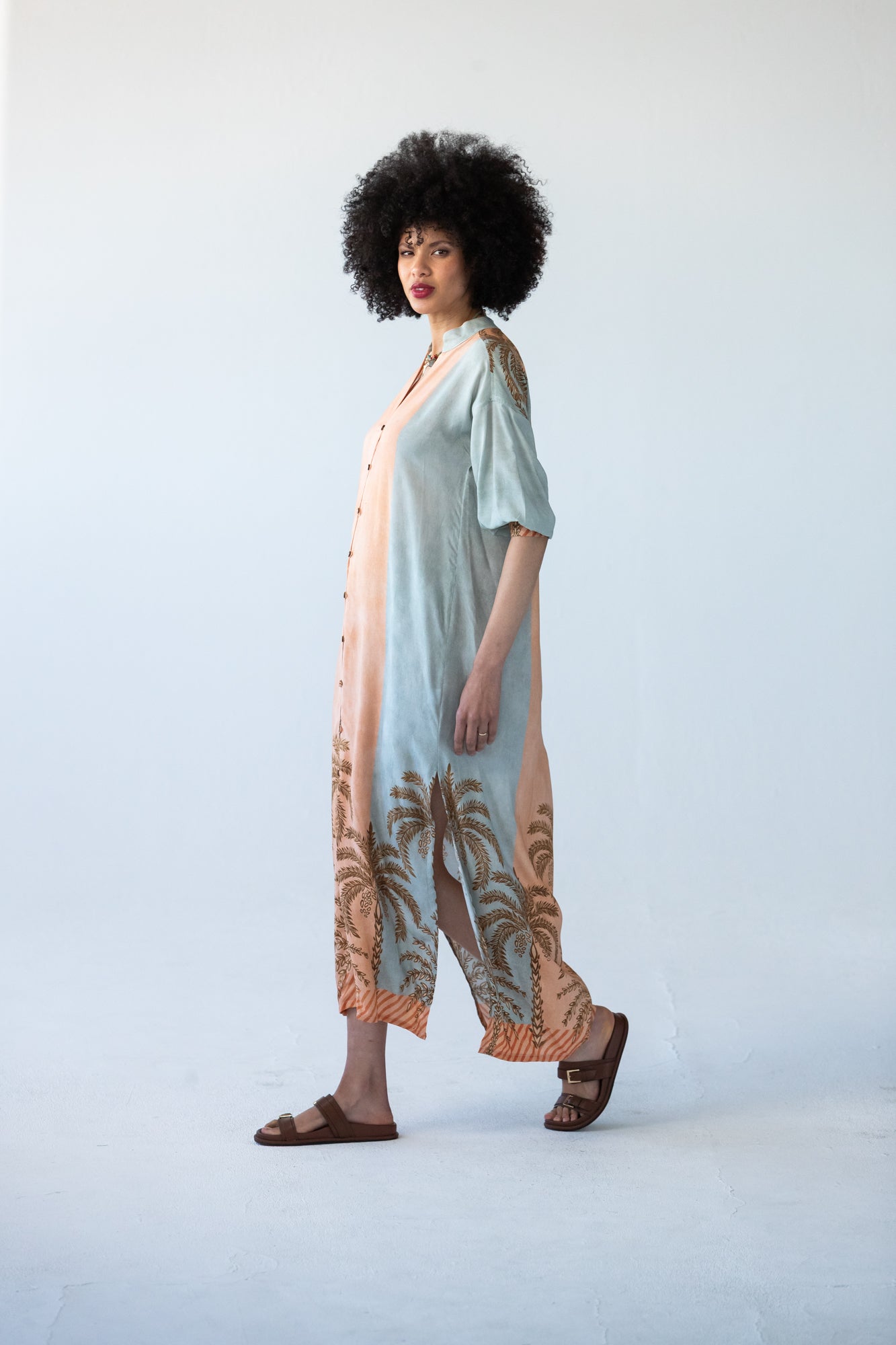 Bailey peach and pale blue symmetrical stripe kaftan, side view showing palm print hem