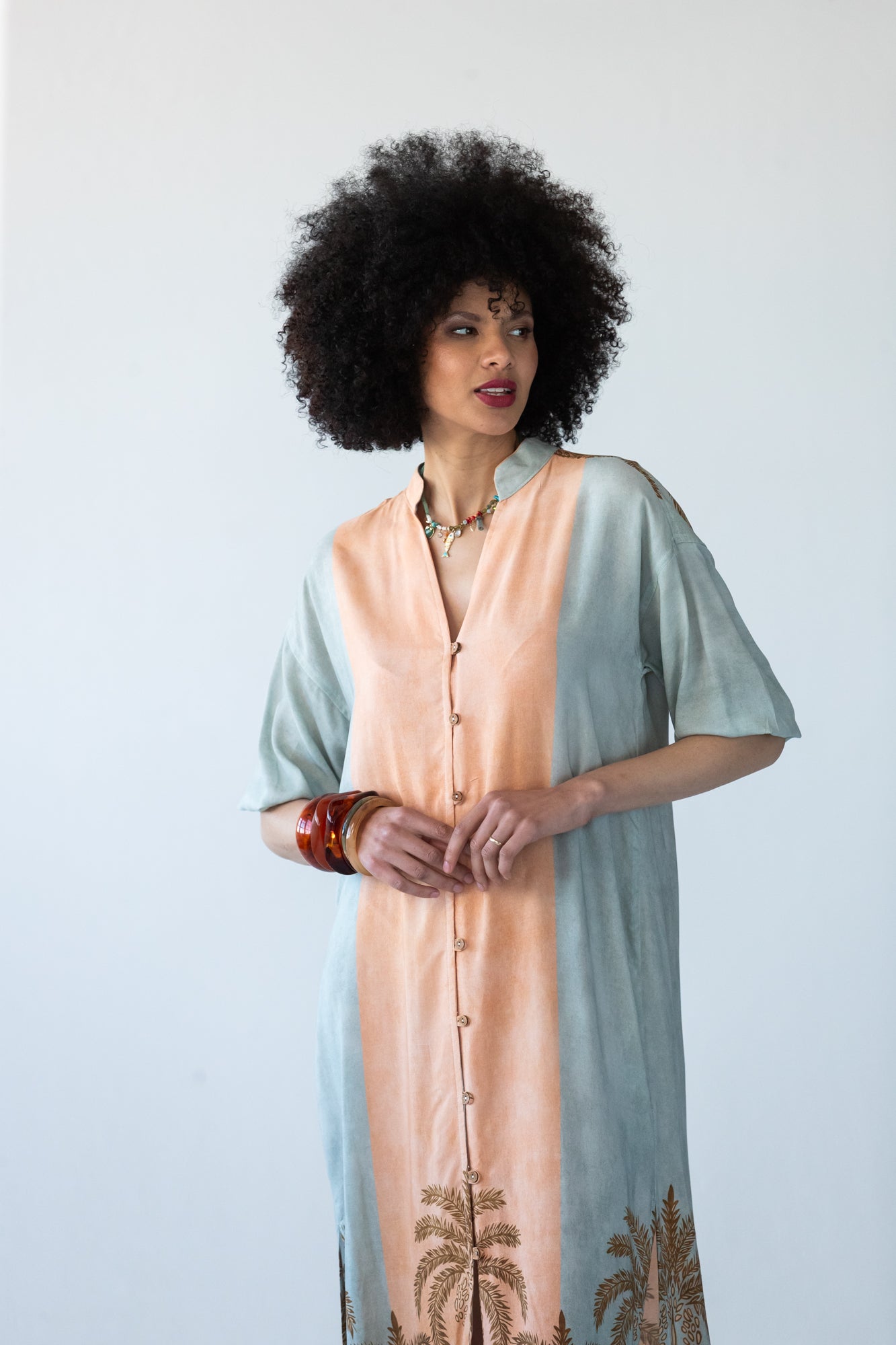 Bailey kaftan, close up front view showing button placket and symmetrical stripe