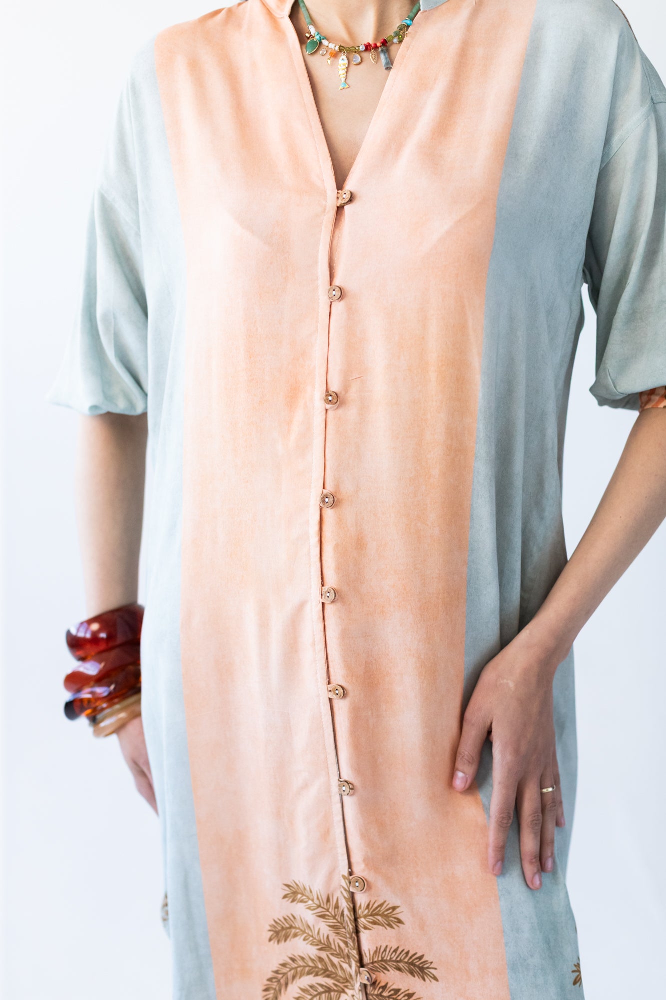 Bailey kaftan, close up of button placket and stripe detail