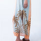 Bailey kaftan, close up of side slit and palm print hem detail
