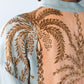 Bailey kaftan, close up back view showing gathered yoke with palm print detail