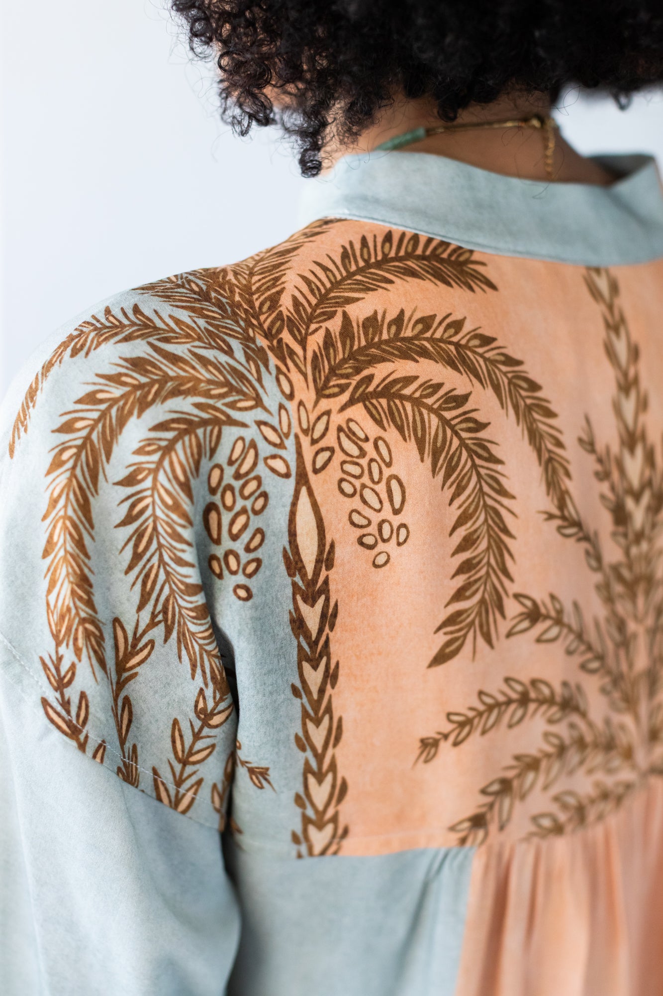 Bailey kaftan, close up back view showing gathered yoke with palm print detail