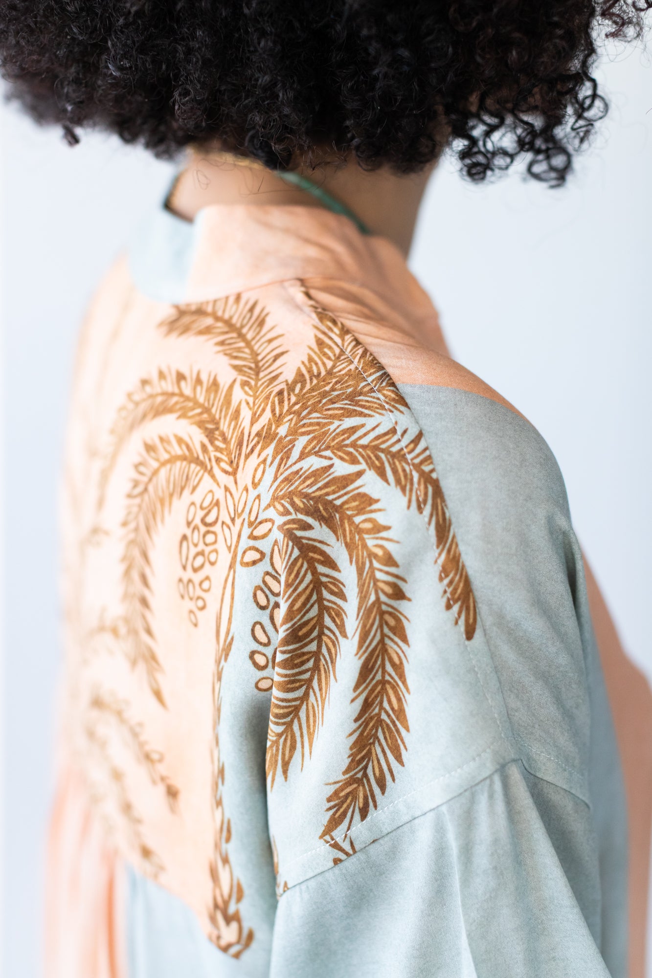Bailey kaftan, back side view showing gathered yoke with palm print detail