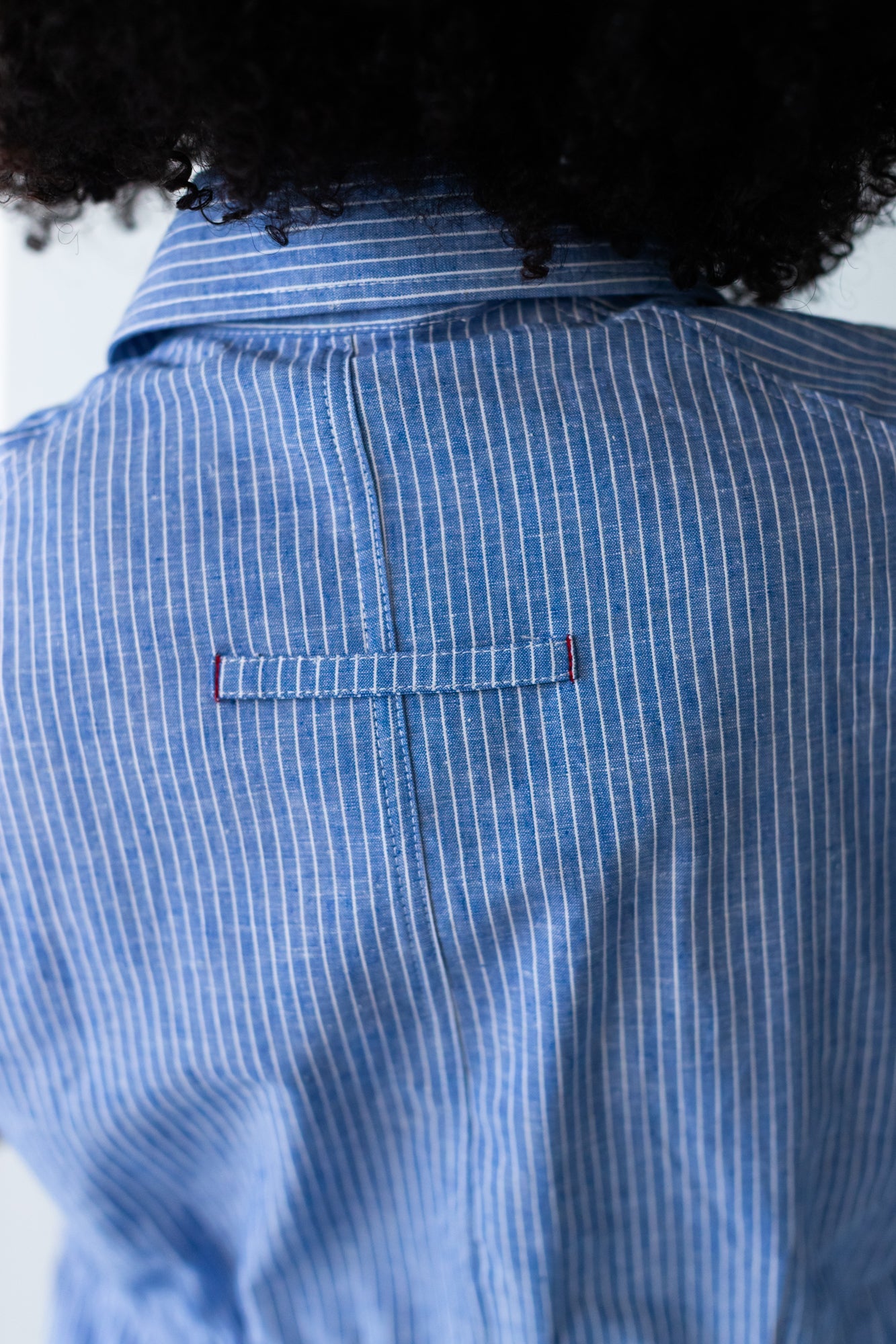 Reese stripe shirt, close up of back loop tab detail