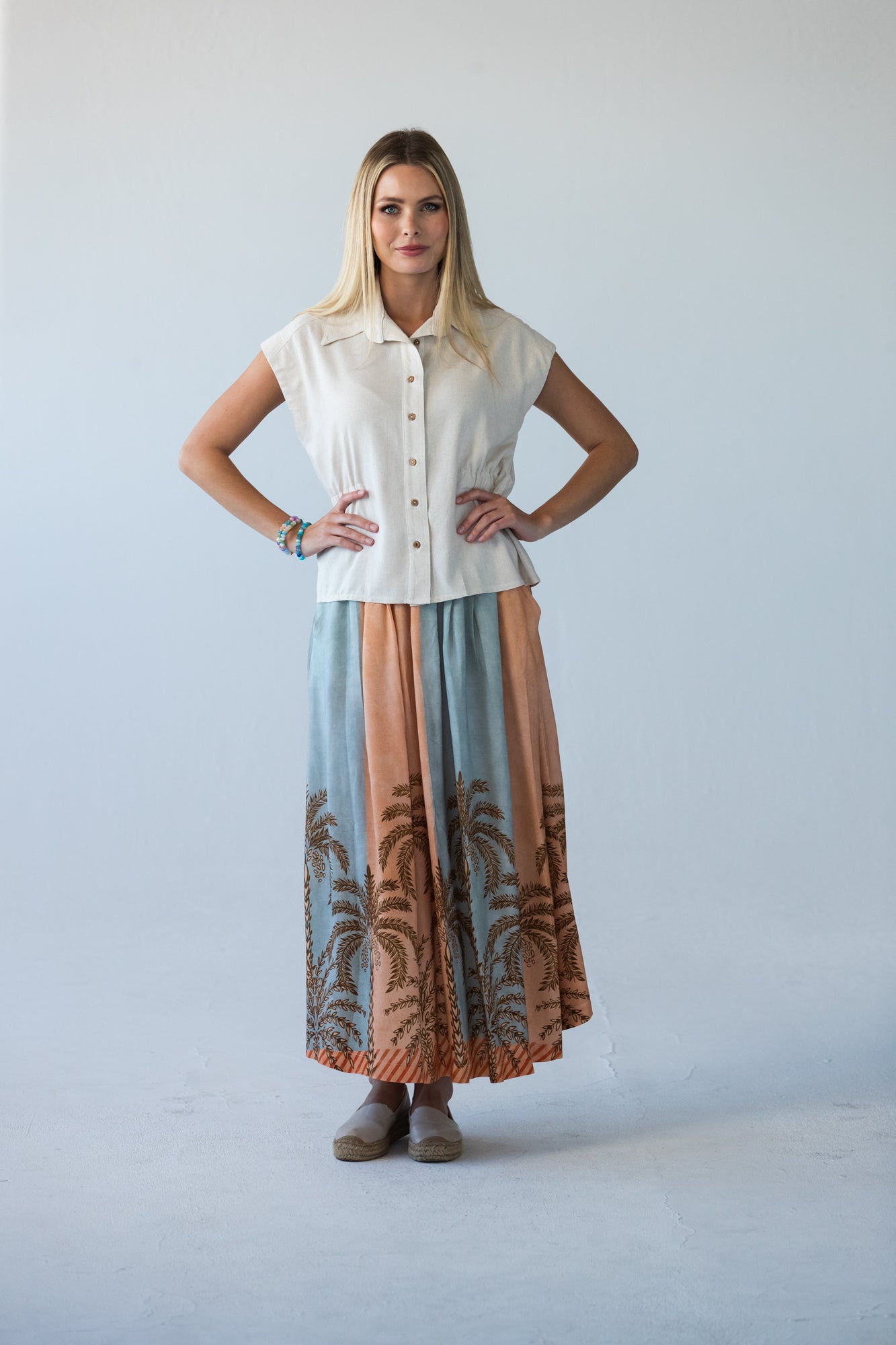 Sorrento peach and pale blue symmetrical stripe skirt, front view styled with cream shirt