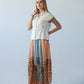 Sorrento stripe palm print skirt, front view with hand at collar