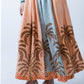 Sorrento stripe palm print skirt, close up of panels with hands at waist