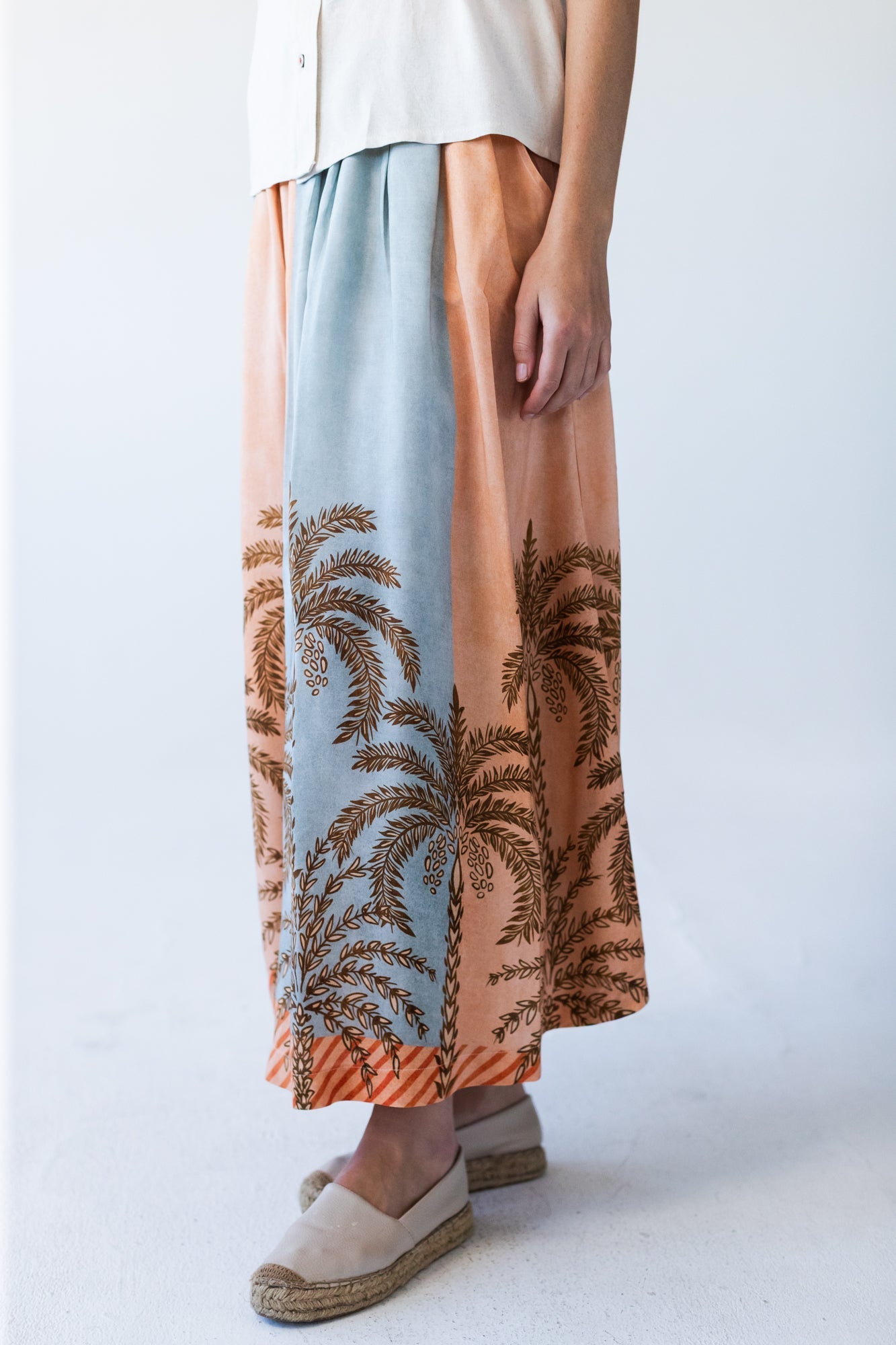 Sorrento stripe palm print skirt, close up of palm print hem detail