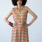 Sutton orange check shirt-dress, front view with hands on hips at the elasticated waist