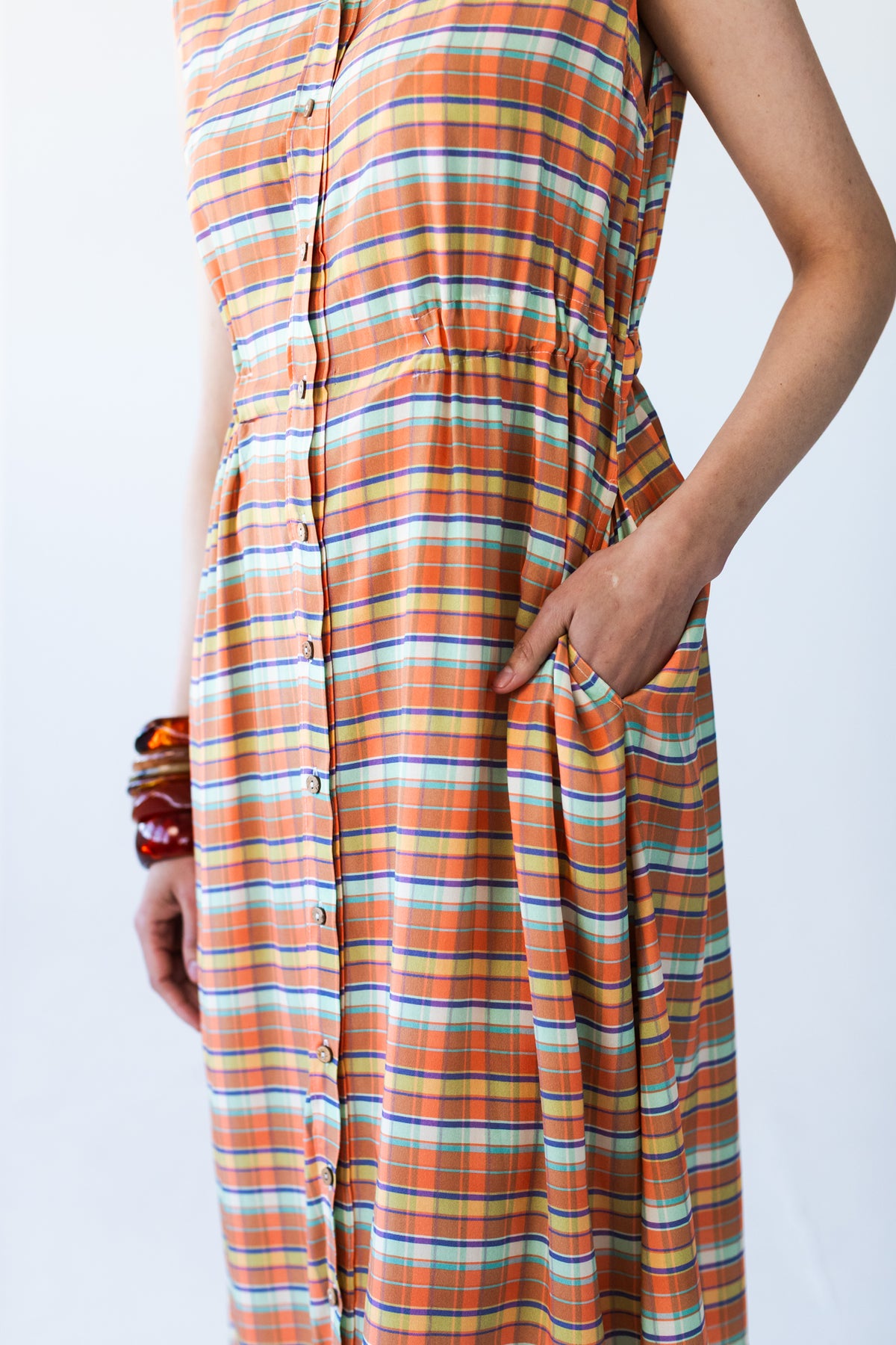 Sutton orange check shirt-dress, close-up of elasticated waist and side pocket