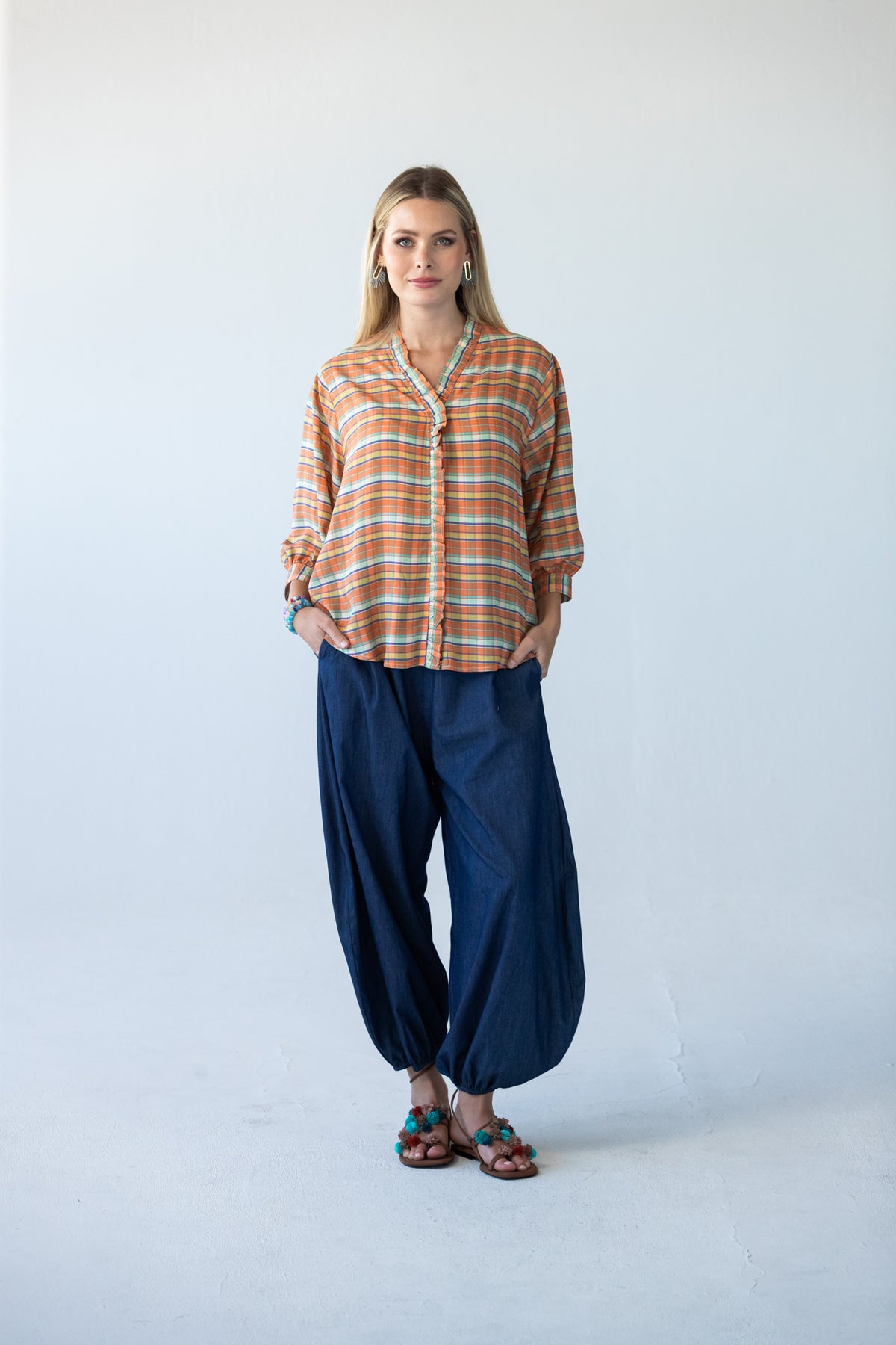 Darcy frill shirt, full-length front view with hands in pockets, styled with Stella balloon pants