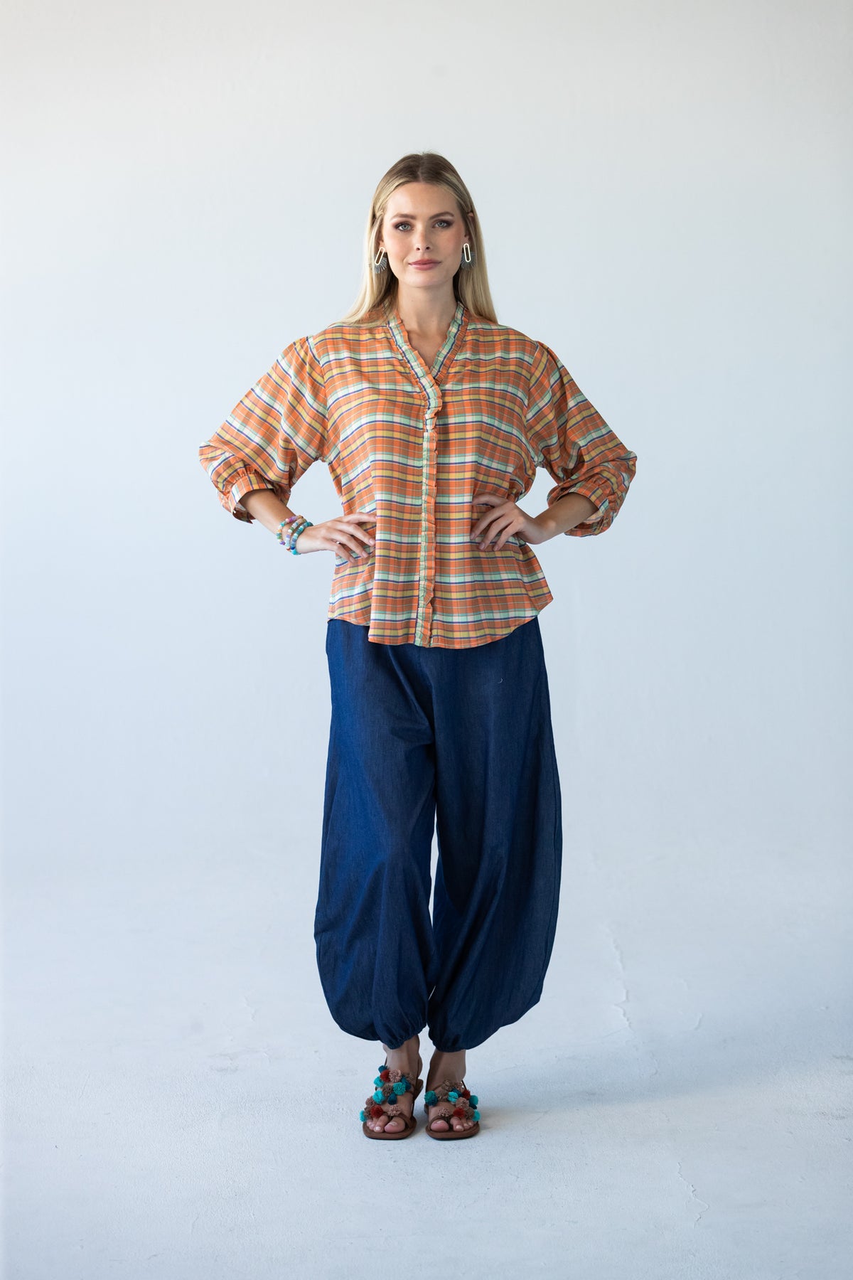 Darcy frill shirt, full-length front view with arms crossed, styled with Stella balloon pants