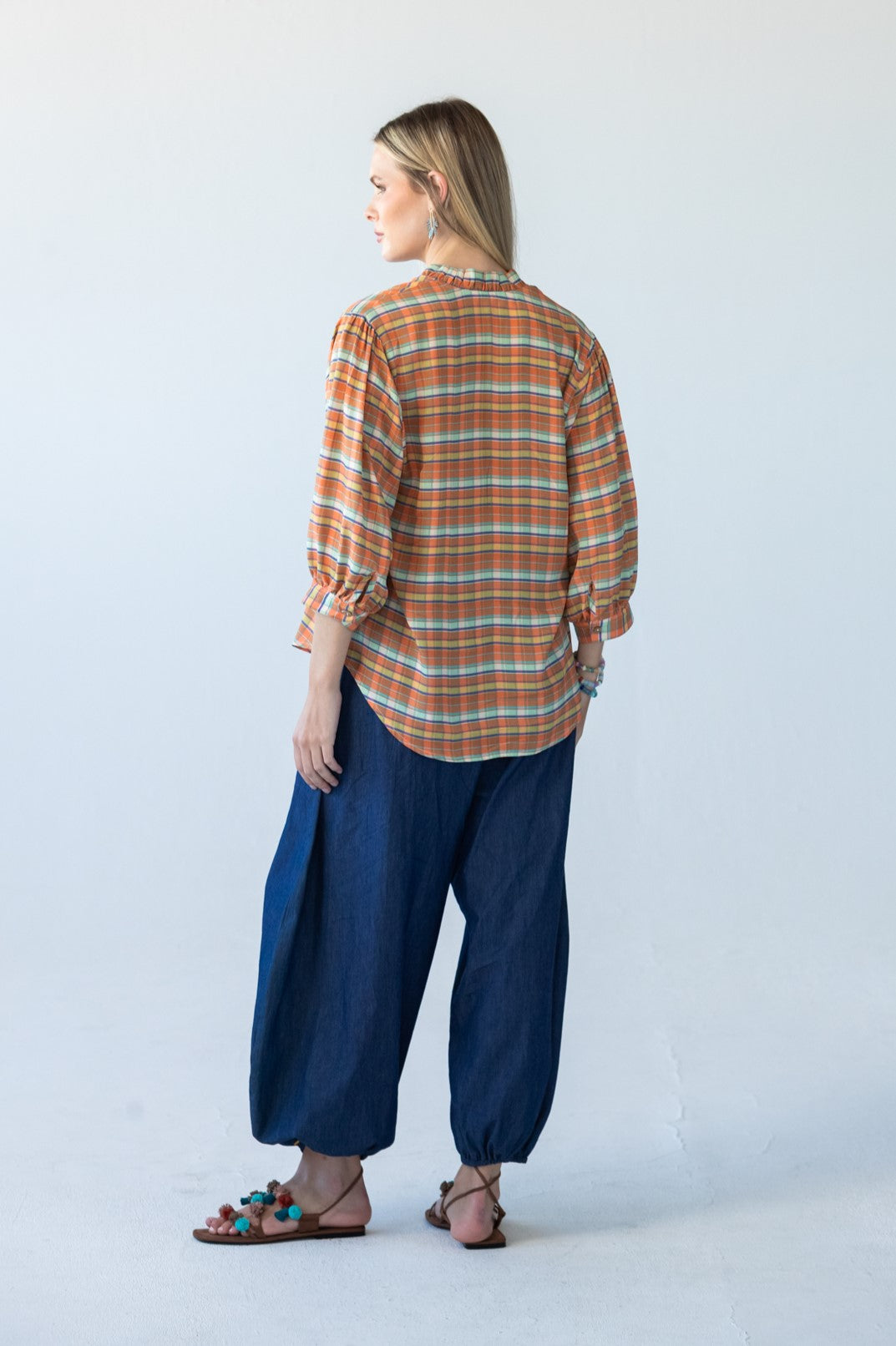 Darcy frill shirt, back view showing gathered sleeves and buttoned cuffs