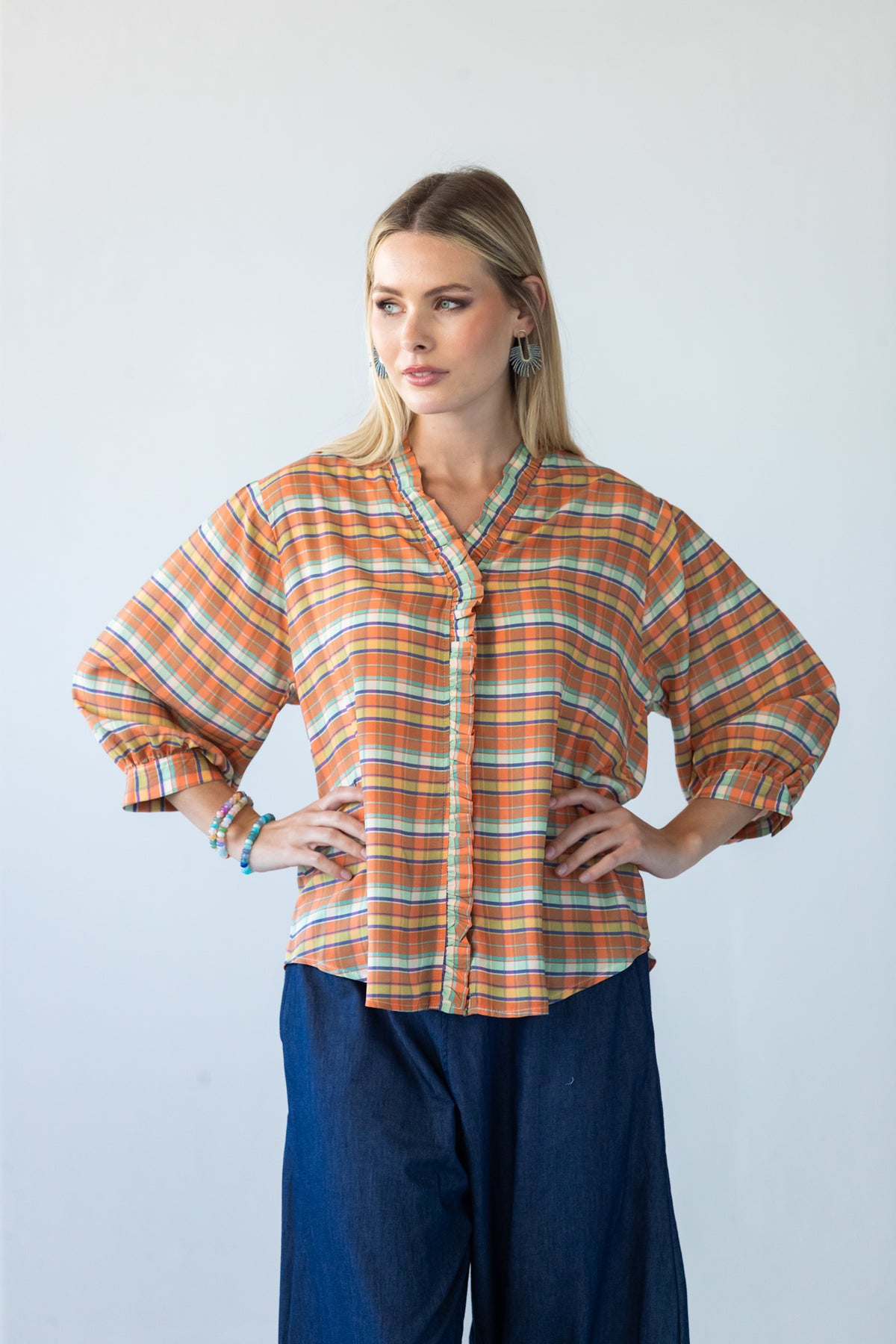 Darcy frill shirt, front view with hands on hips showing three-quarter sleeves
