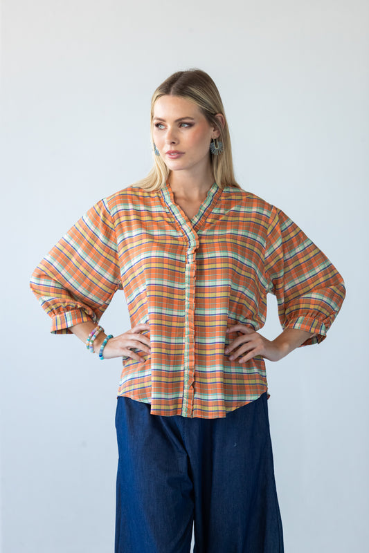 Darcy frill shirt, front view with hands on hips showing three-quarter sleeves