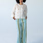 Amelia milk relaxed shirt, front view full length styled with Sydney pants in blue and green stripe