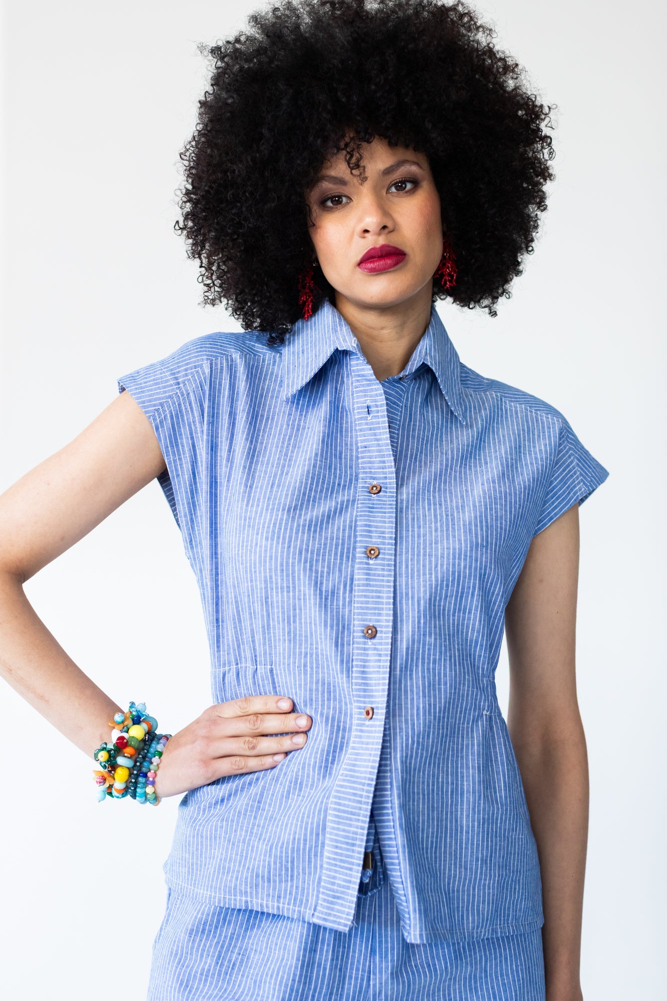 Reese stripe shirt, front view with hand on hip