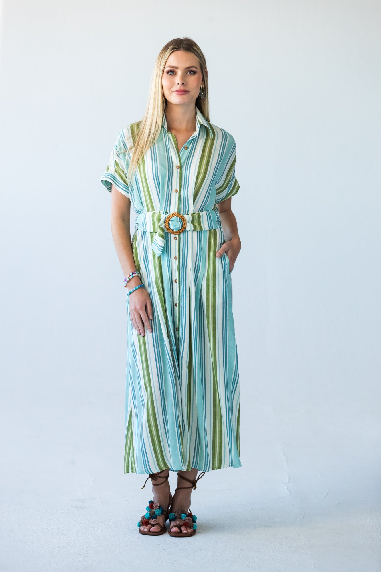 Quinn blue green stripe dress, front view styled with woven buckle belt