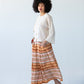 Sorrento Sunset Stripe skirt, side profile walking pose
