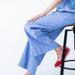 Sydney wide leg stripe pants, close up seated view showing wide leg drape
