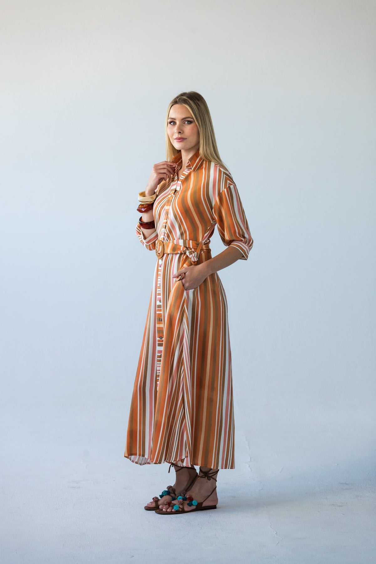 Cassidy Sunset Stripe dress, three-quarter view showing belt buckle and hip pocket
