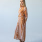 Cassidy Sunset Stripe dress, side profile, full length, hand in pocket