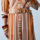 Cassidy Sunset Stripe dress, close-up of belt, woven buckle and button stand