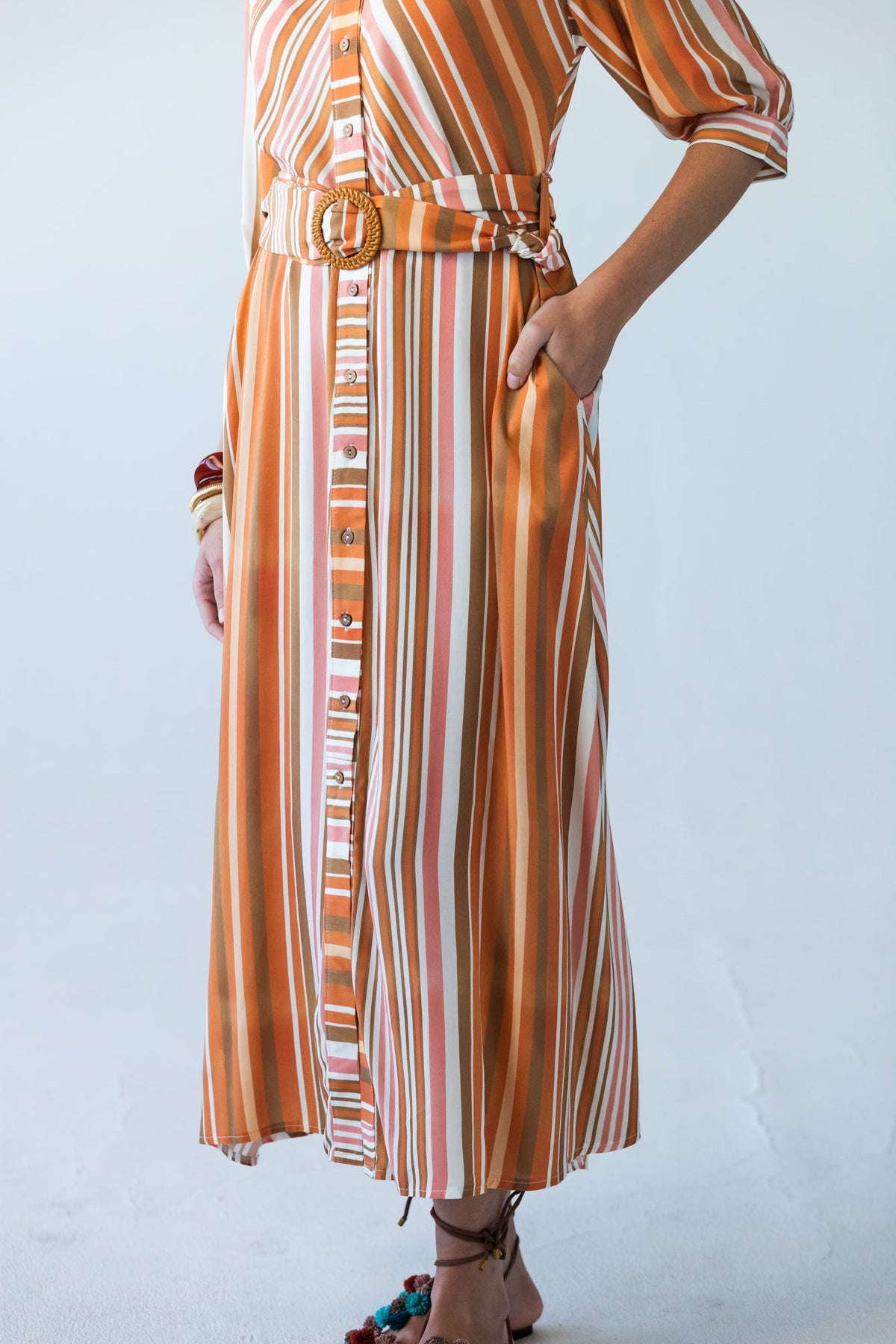 Cassidy Sunset Stripe dress, close-up of hip pocket and belt tie detail