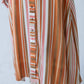 Cassidy Sunset Stripe dress, close-up of skirt showing vertical stripe and button placket
