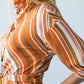 Cassidy Sunset Stripe dress, close-up of shoulder, sleeve and collar from the side