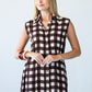 Sutton chocolate check shirt-dress, front view with hands clasped at the waist