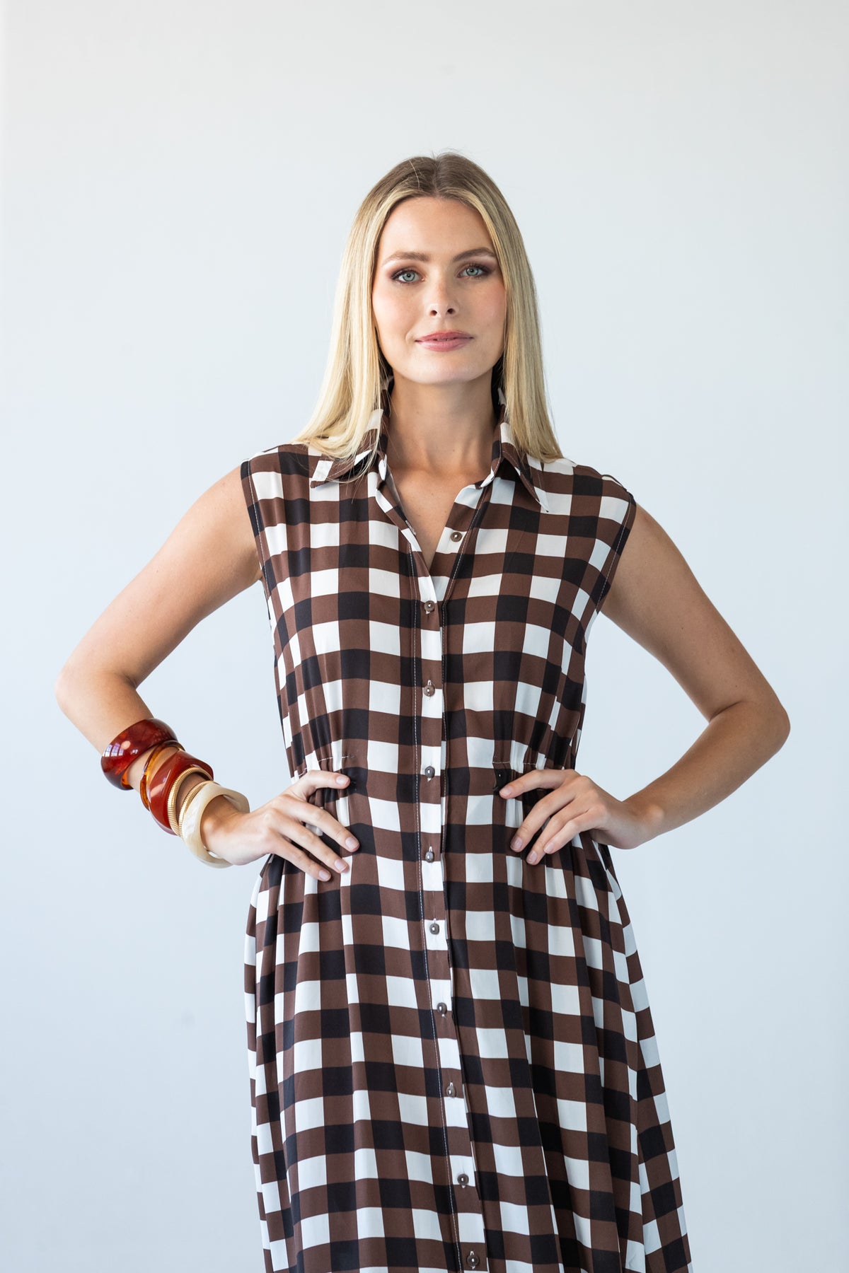 Sutton chocolate check shirt-dress, front view with hands on hips at the elasticated waist