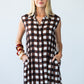 Sutton chocolate check shirt-dress, front view with hands in side pockets