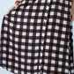Sutton chocolate check shirt-dress, skirt held out showing midi length and button placket