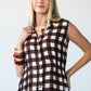 Sutton chocolate check shirt-dress, front view with hand at collar showing elasticated waist